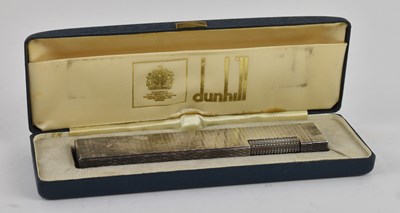 Lot 304 - DUNHILL; an early to mid 20th century silver...