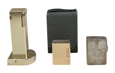 Lot 315 - S T DUPONT; a boxed mid century yellow metal...