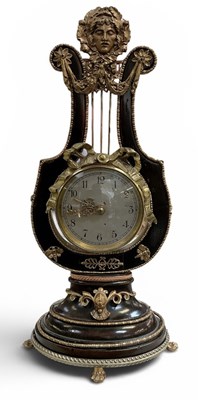 Lot 150 - An early 20th century French lyre mantel clock,...