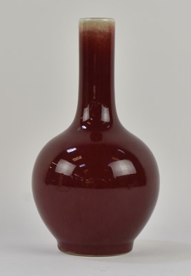 Lot 1070 - A Chinese red glazed sang de boeuf bottle vase,...