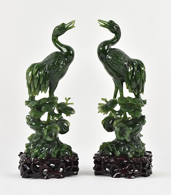 Lot A pair of Chinese carved nephrite jade figures...