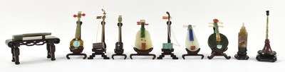 Lot 1042 - A cased collection of ten Chinese carved...