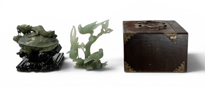 Lot 1065 - A Chinese carved green jade figure of three...