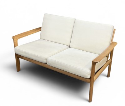 Lot 18 - A modern Danish light oak framed two seater...