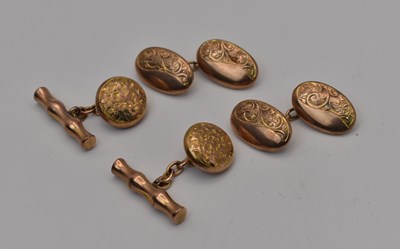 Lot 559 - Two pairs of 9ct gold engraved cufflinks each...