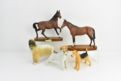 Lot 116 - Two Royal Doulton brown matt horses on...