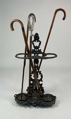 Lot 159 - A cast iron stick stand, height 69cm, together...