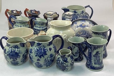 Lot 277 - A quantity of blue and white decorative jugs,...