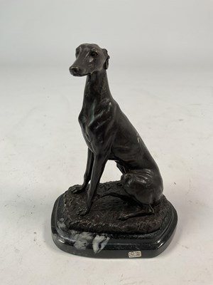 Lot 139 - A bronze model of a seated greyhound, height...