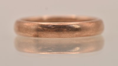 Lot 1328 - A 9ct rose gold band ring, size R, approx 4.3g.