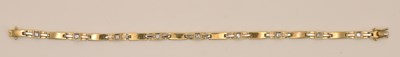 Lot 1417 - A 9ct yellow gold tiny diamond set bar link...