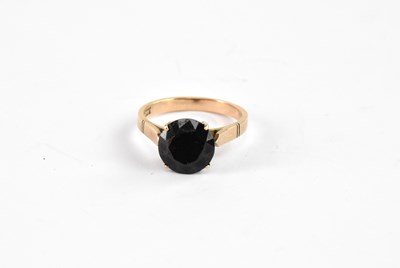 Lot 868 - A 14ct yellow gold ring set with a garnet,...