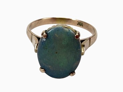 Lot 869 - A 14ct yellow gold ring set with an oval opal,...