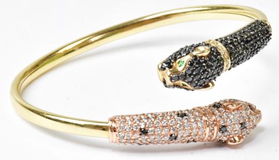 Lot 901 - EFFY; a 14ct yellow gold bangle, the ends in...