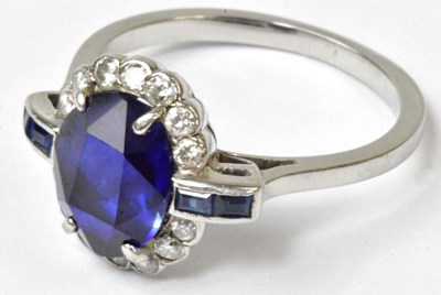 Lot 742 - A white metal ring set with a central oval...
