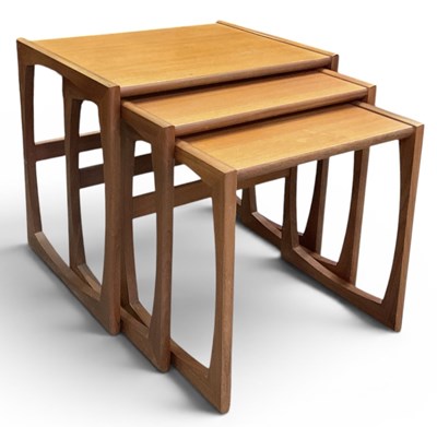 Lot 79 - G PLAN; a mid century teak nest of three...