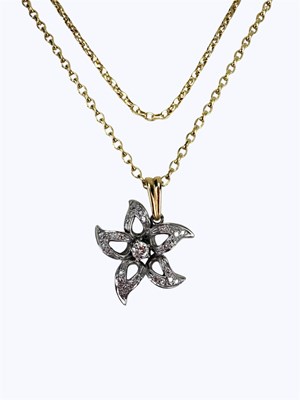 Lot 926 - An 18ct white gold flower head pendant, set...