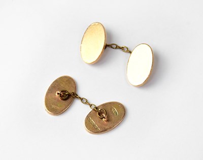 Lot 1045 - A pair of 9ct gold oval cufflinks, stamped 375,...