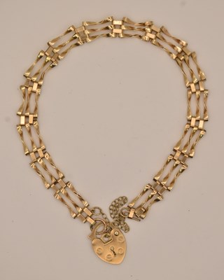 Lot 1420 - A 9ct yellow gold three bar gate bracelet,...
