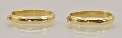 Lot 1387 - A pair of 18ct yellow gold hoop earrings,...