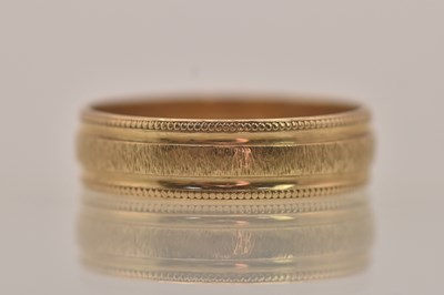 Lot 1345 - A 9ct yellow gold band ring, size K/L, approx...