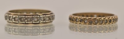 Lot 1326 - Two 9ct gold eternity rings, one yellow gold...