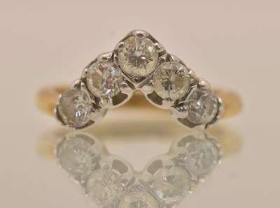 Lot 1281 - A yellow gold five stone diamond set wishbone...