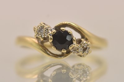 Lot 1338 - A 9ct yellow gold diamond and sapphire set...