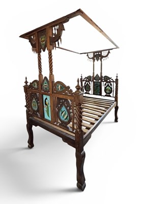 Lot 12 - An Indian carved hardwood 'Lamu' bed, the...