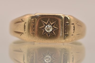 Lot 1307 - A 9ct yellow gold signet ring, with star set...