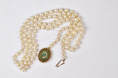 Lot 945 - A single-strand pearl necklace with a 9ct...