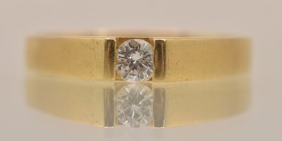 Lot 1308 - An 18ct yellow gold tension set diamond ring,...
