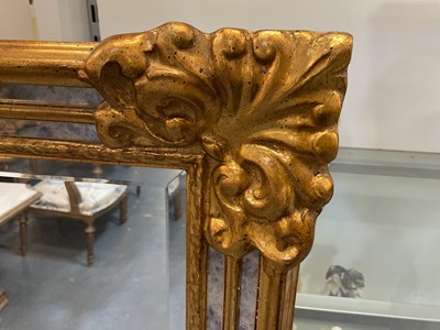 Lot 37 - A modern gilt framed bevelled glass...