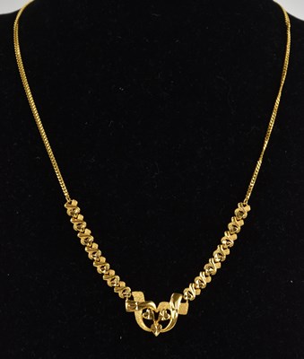 Lot 1350 - A 22ct bright yellow gold Middle Eastern...