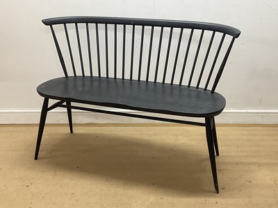Lot 615 - ERCOL; a spindle back love seat in factory...