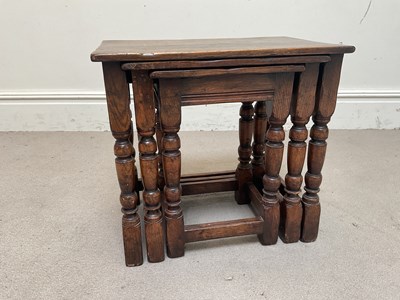 Lot 1135 - A nest of three reproduction oak occasional...