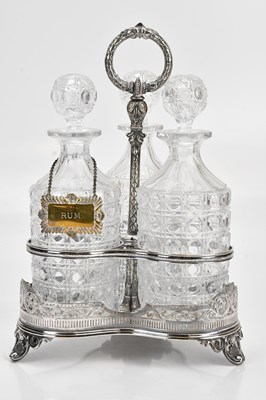 Lot 18 - A Victorian silver plated bottle stand, with...