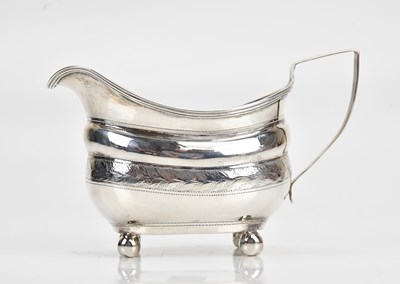 Lot 421 - A George III hallmarked silver cream jug, with...
