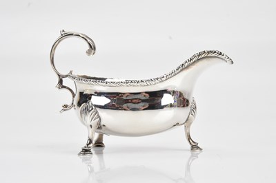 Lot 389 - A George III hallmarked silver cream jug, with...