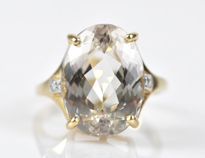 Lot 518 - A 9ct yellow gold dress ring set with an oval...
