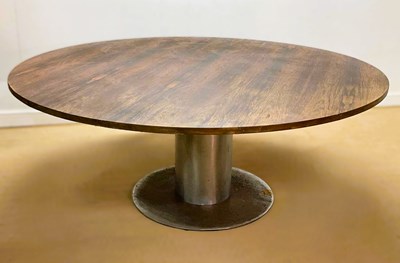 Lot 617 - A mid 20th century large circular veneered...
