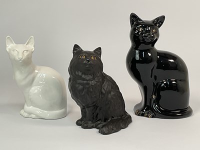 Lot 146 - BESWICK; two models of black cats, together...