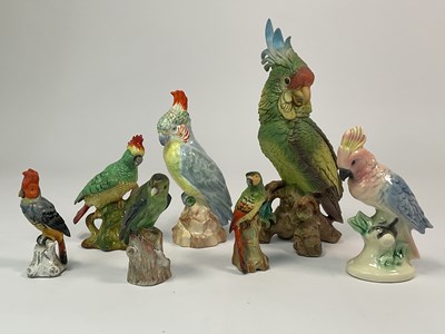 Lot 188 - A group of seven porcelain models of cockatoos,...