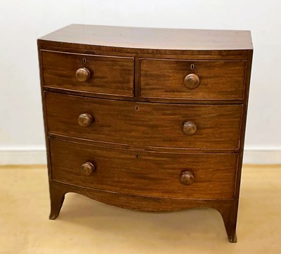 Lot 651 - A 19th century mahogany bowfront chest of two...