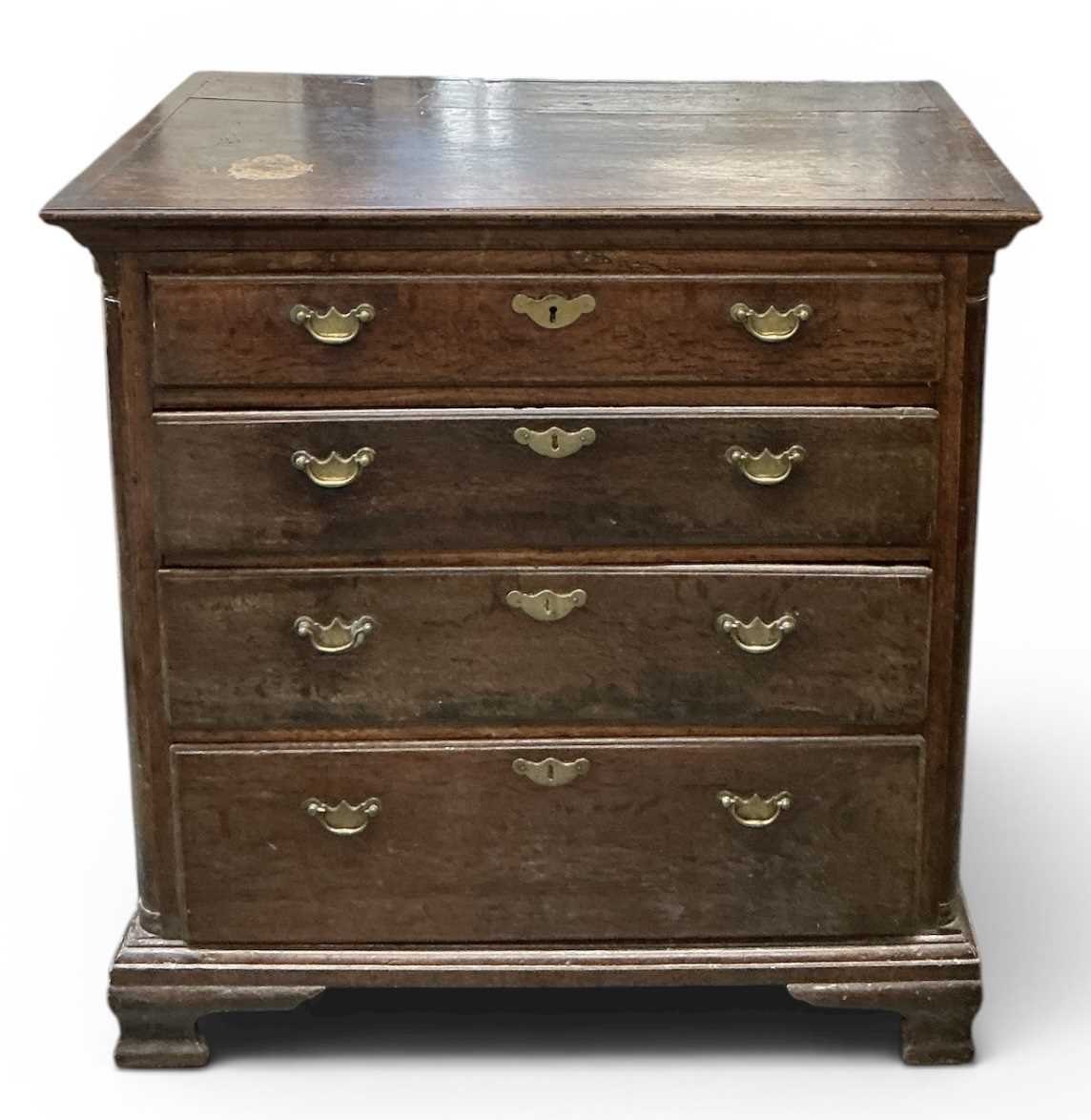 Lot 44 - A 19th century oak chest of four long drawers...