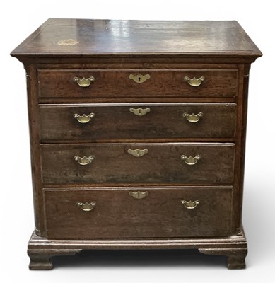 Lot 44 - A 19th century oak chest of four long drawers...