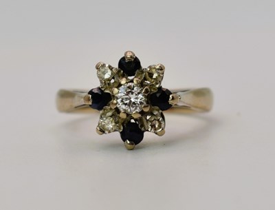 Lot 436 - An 18ct white gold, diamond and sapphire...