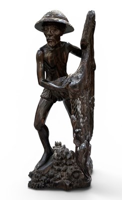 Lot 1067 - An early to mid 20th century Balinese carved...