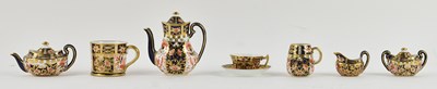 Lot 494 - ROYAL CROWN DERBY; a miniature cabinet Imari...