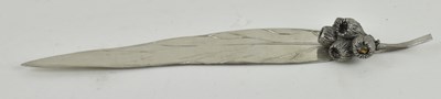 Lot 1262 - An unusual white metal letter opener in the...